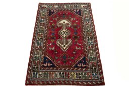 Surface texture of 2000s Shiraz rug with natural Wool and intricate pattern