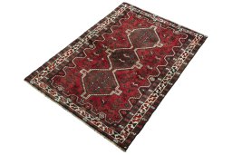 Corner detail of 2000s Shiraz rug showing border pattern and Wool pile