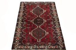 Surface texture of 2000s Shiraz rug with natural Wool and intricate pattern