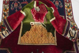 Corner detail of 2000s Shiraz rug showing border pattern and Wool pile