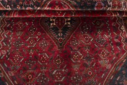 Corner detail of 2000s Shiraz rug showing border pattern and Wool pile