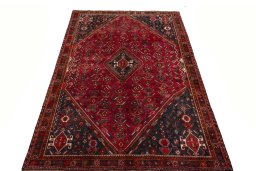 Surface texture of 2000s Shiraz rug with natural Wool and intricate pattern