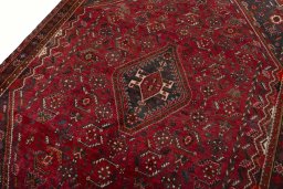 Backside of handmade 2000s Shiraz rug showing knot structure and weave density