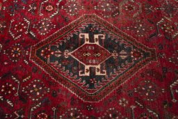Central medallion detail of 2000s Shiraz rug from Iran / Persia