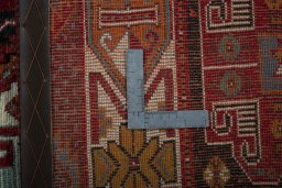 Surface texture of 2000s Shiraz rug with natural Wool and intricate pattern