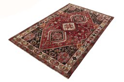 Corner detail of 2000s Shiraz rug showing border pattern and Wool pile