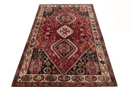 Surface texture of 2000s Shiraz rug with natural Wool and intricate pattern