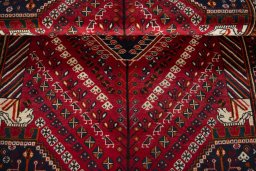 Corner detail of 2000s Shiraz rug showing border pattern and Wool pile