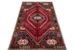 Surface texture of 2000s Shiraz rug with natural Wool and intricate pattern