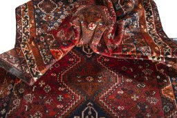 Corner detail of 1970s Shiraz rug showing border pattern and Wool pile