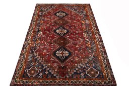 Surface texture of 1970s Shiraz rug with natural Wool and intricate pattern
