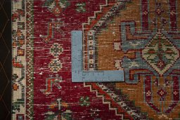 Backside of handmade 2000s Shiraz rug showing knot structure and weave density