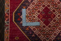 Backside of handmade 2000s Shiraz rug showing knot structure and weave density
