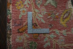 Backside of handmade 2000s Shiraz rug showing knot structure and weave density