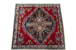 Surface texture of 2000s Shiraz rug with natural Wool and intricate pattern