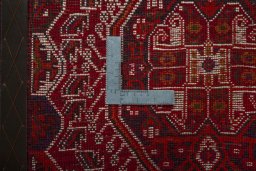 Backside of handmade 2000s Shiraz rug showing knot structure and weave density
