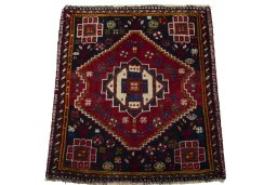 Surface texture of 2000s Shiraz rug with natural Wool and intricate pattern