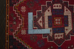Backside of handmade 2000s Shiraz rug showing knot structure and weave density