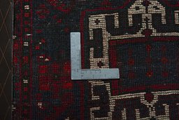 Backside of handmade 2000s Shiraz rug showing knot structure and weave density