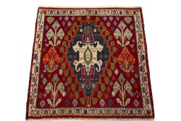 Surface texture of 2000s Shiraz rug with natural Wool and intricate pattern