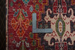 Backside of handmade 2000s Shiraz rug showing knot structure and weave density