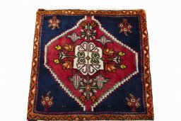 Surface texture of 2000s Shiraz rug with natural Wool and intricate pattern