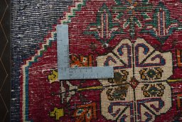 Backside of handmade 2000s Shiraz rug showing knot structure and weave density