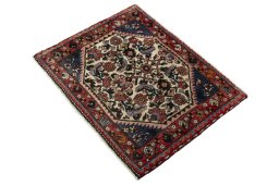 Corner detail of 2000s Shiraz rug showing border pattern and Wool pile