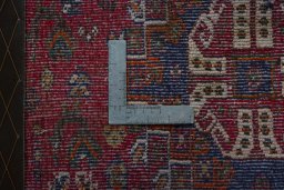 Backside of handmade 2000s Shiraz rug showing knot structure and weave density