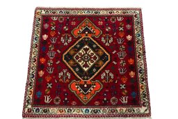 Surface texture of 2000s Shiraz rug with natural Wool and intricate pattern