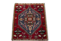 Surface texture of 2000s Shiraz rug with natural Wool and intricate pattern