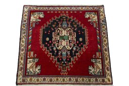 Surface texture of 2000s Shiraz rug with natural Wool and intricate pattern