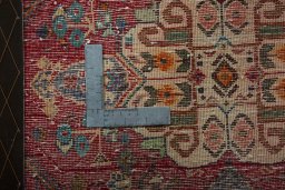 Backside of handmade 2000s Shiraz rug showing knot structure and weave density