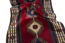 Corner detail of 2000s Shiraz rug showing border pattern and Wool pile
