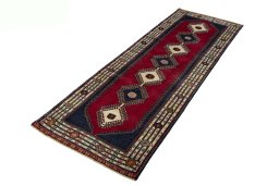 Corner detail of 2000s Shiraz rug showing border pattern and Wool pile