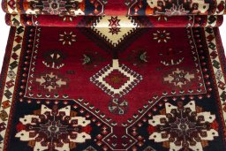 Corner detail of 2000s Shiraz rug showing border pattern and Wool pile