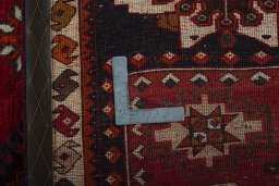 Surface texture of 2000s Shiraz rug with natural Wool and intricate pattern