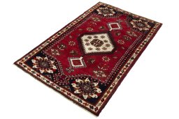 Corner detail of 2000s Shiraz rug showing border pattern and Wool pile