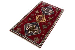 Corner detail of 2000s Shiraz rug showing border pattern and Wool pile