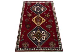Surface texture of 2000s Shiraz rug with natural Wool and intricate pattern