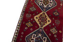 Backside of handmade 2000s Shiraz rug showing knot structure and weave density