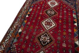 Backside of handmade 2000s Shiraz rug showing knot structure and weave density