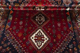 Full view of 2000s Shiraz rug from Iran / Persia, 263 × 172 cm in Red tones