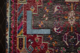 Backside of handmade 2000s Shiraz rug showing knot structure and weave density