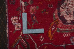Backside of handmade 2000s Shiraz rug showing knot structure and weave density