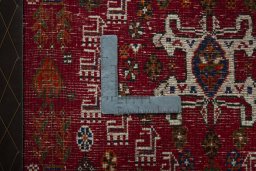 Backside of handmade 2000s Shiraz rug showing knot structure and weave density