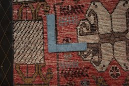 Backside of handmade 2000s Shiraz rug showing knot structure and weave density