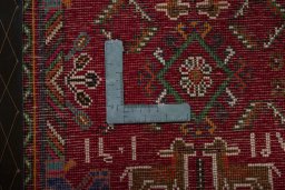 Backside of handmade 2000s Shiraz rug showing knot structure and weave density