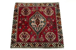 Surface texture of 2000s Shiraz rug with natural Wool and intricate pattern