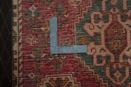 Backside of handmade 2000s Shiraz rug showing knot structure and weave density